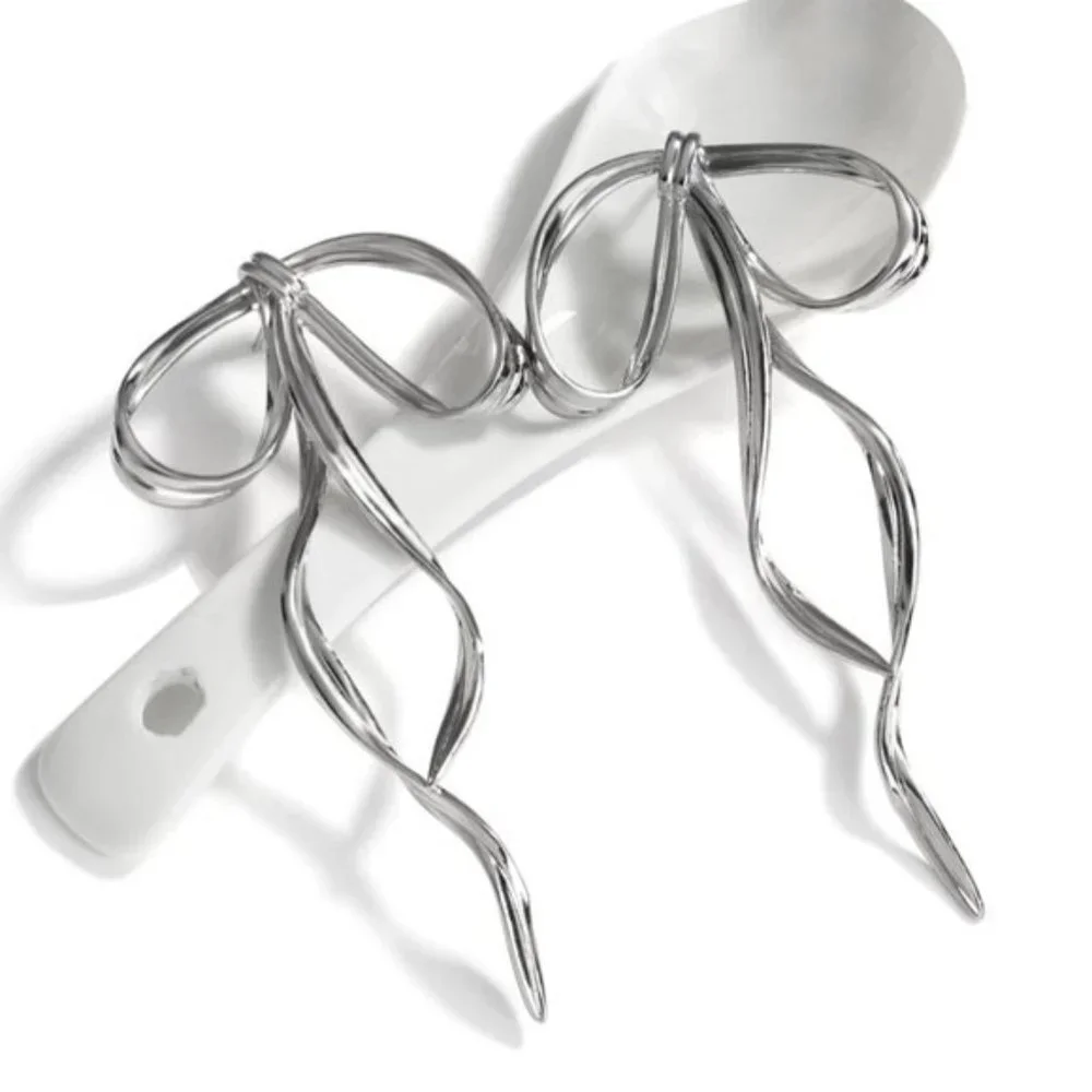 Anthro Silver Bow Earring